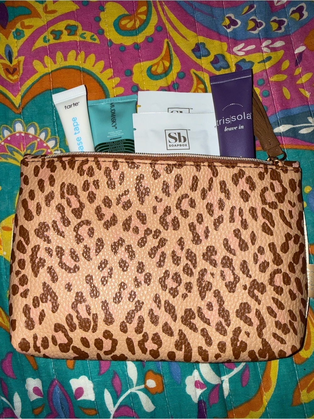 IPSY bag with travel size makeup items